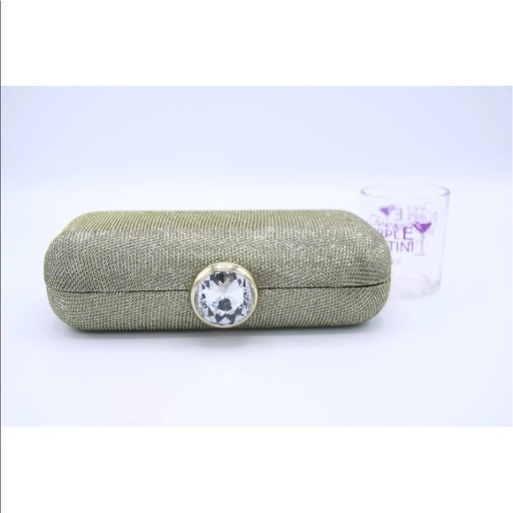 GOLD clutch with a rhinestone on top